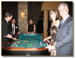 Guests enjoying a game of craps at a recent party