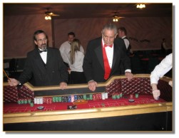 Two of our handsome craps dealers in action